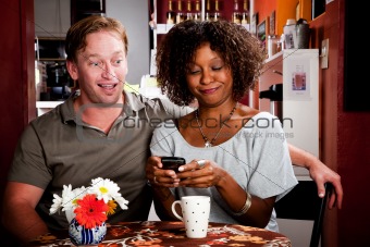 Mixed Race Couple with Handheld Phone