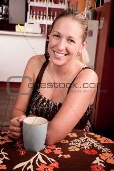  Pretty blonde woman with coffee