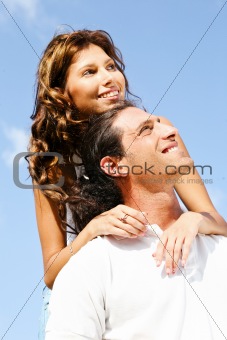 Couple smiling and looking away