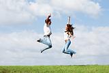 Jumping joyful couple