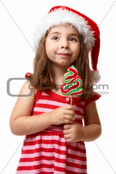Pretty santa girl with christmas lollipop