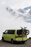 Van and bicycle in mountains