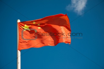 Chinese flag against blue sky