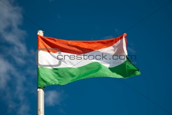 Hungarian flag against blue sky