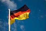 German flag against blue sky