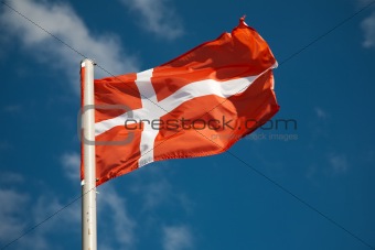 Danish flag against blue sky
