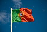 Portuguese flag against blue sky
