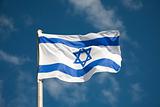 Israel flag against blue sky