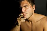 Young Sexy Man Smoking a cigarette