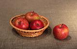Group of a red apples in basket.