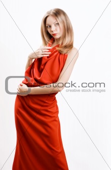 Young beautiful model in a red dress