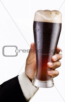 Glass of beer is in a hand