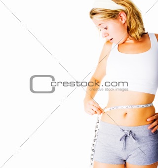 Young Woman Measuring Herself On White