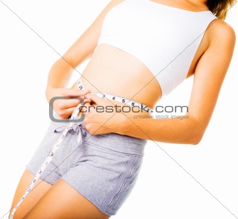 Young Woman Measuring Herself On White