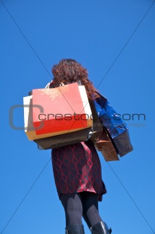 woman full of shopping bags