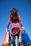 back woman with shopping bags