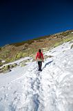 red woman on snow path