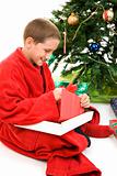 Child Opening Christmas Gift