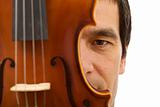 Man face hidden behind violin