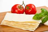 lasagna plates, basil, tomatoes and mozzarella