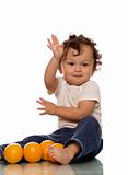 Child with oranges.