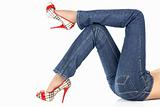Lying female legs in jeans