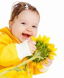 Laughing baby with sunflower