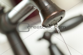 Close-up of Water Dripping from Water Faucet