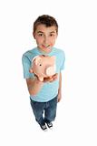Smiling boy holding a pink pig money box