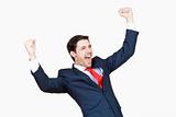 young business executive in suit cheering jumping in the air isplated on white