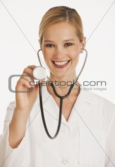 female doctor holding up stethescope