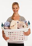 young woman holding laundry basket
