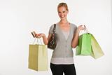 young woman with shopping bags and credit card