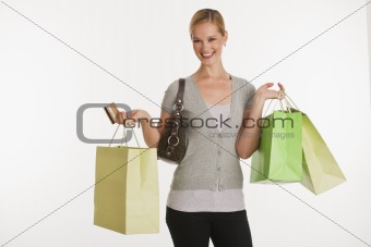 young woman with shopping bags and credit card