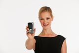 business woman holding up phone towards camera with copy space
