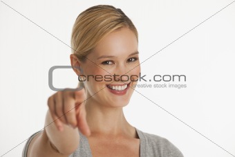 young woman pointing at camera
