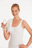 young woman in workout clothes with bottle of water