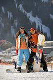Lucky couple  snowboarders  in a mountain valley