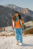 Lucky girl snowboarder in a mountain valley
