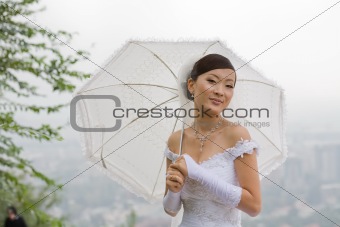 Bride with umbrella