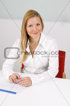 young woman writing notes