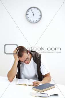 student reading under a clock