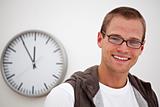 smiling man and a wall clock