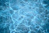 Abstract blue background - sunlight on a water surface