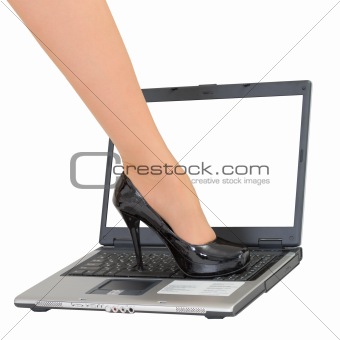 Female foot on the laptop keyboard - game over