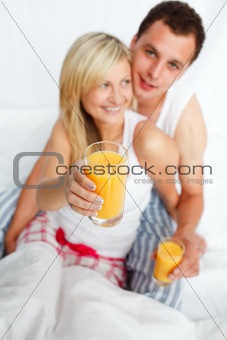 Woman holding a glass of orange juice