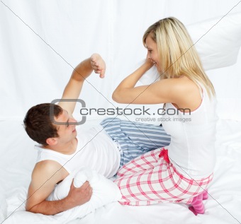 Lovers having a pillow fight