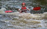 teenage girl white water kayaking