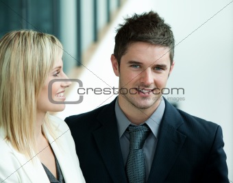 Smiling businessman with his female colleague