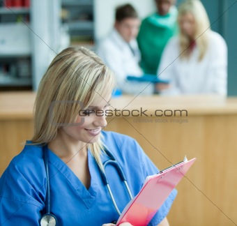 Nurse and group of doctors in a hospital